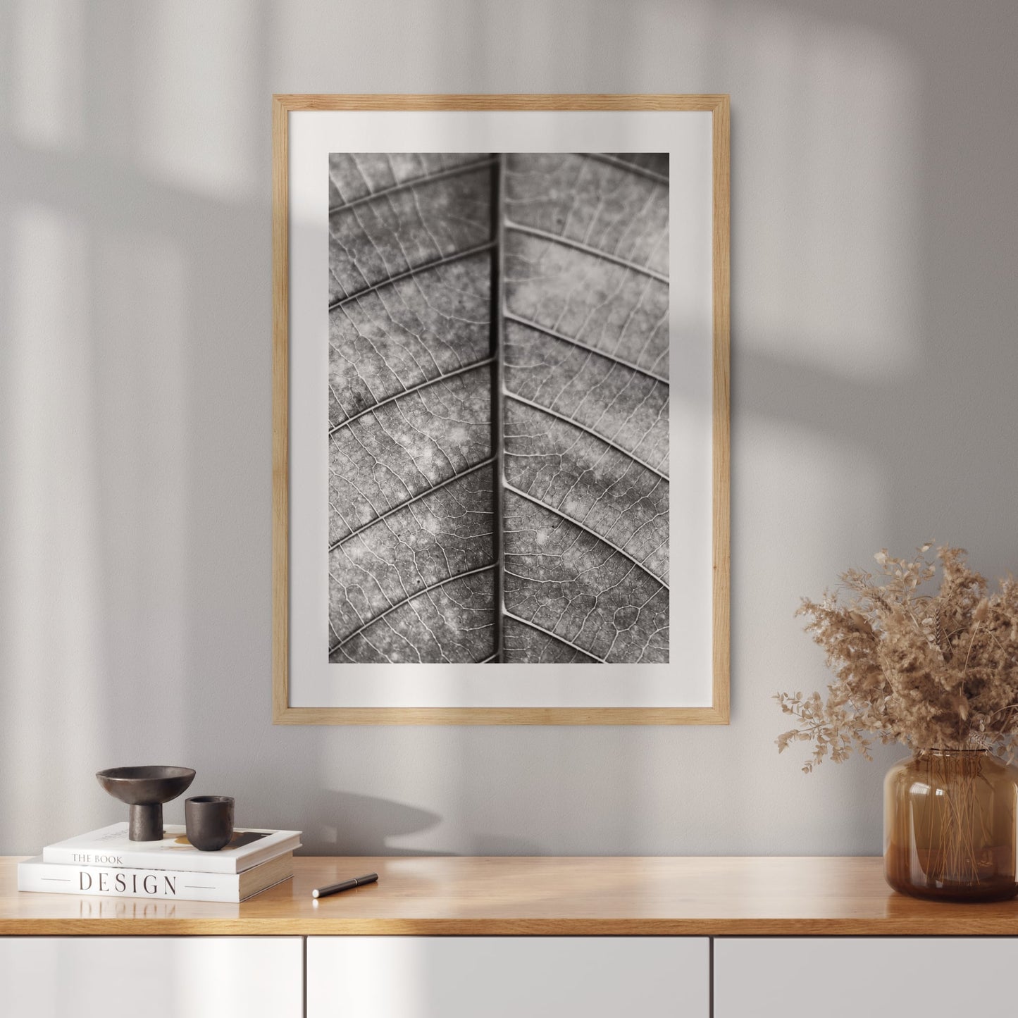 Poster with a black and white photo of a leaf