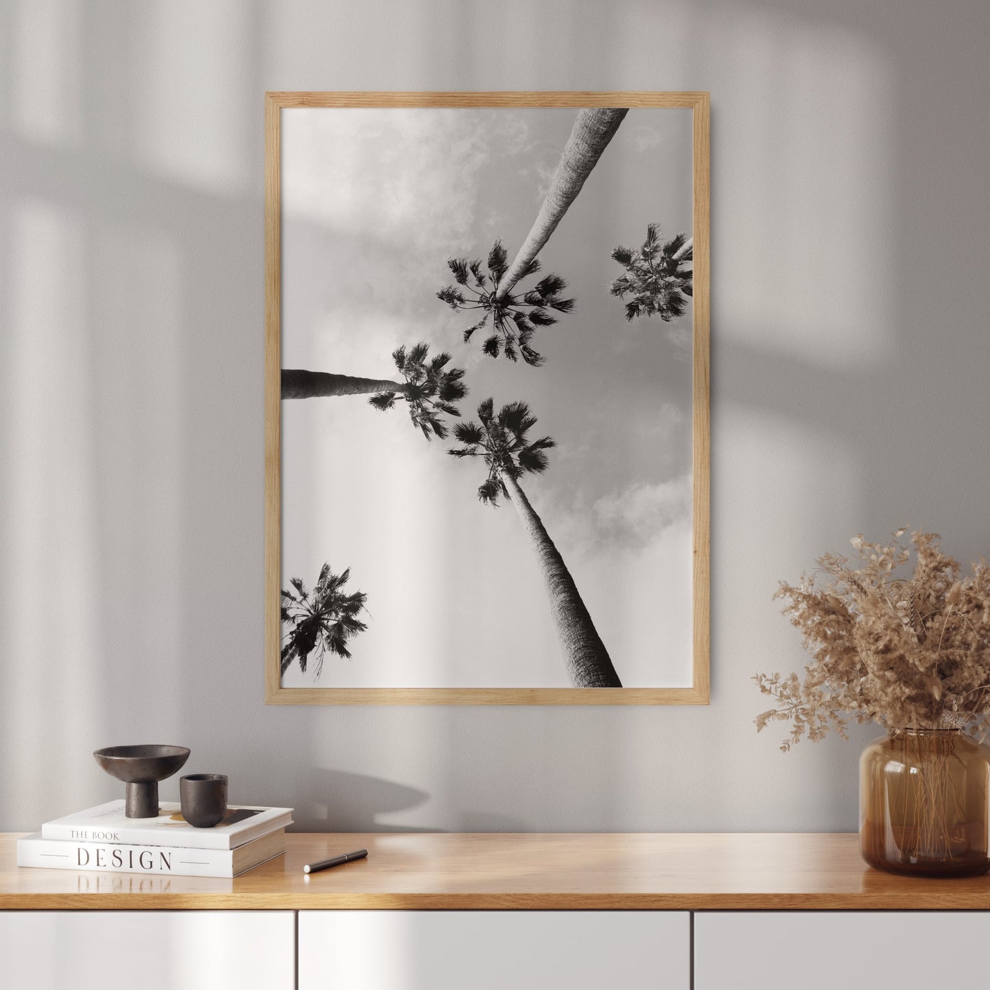 Poster with black and white photo of palm trees