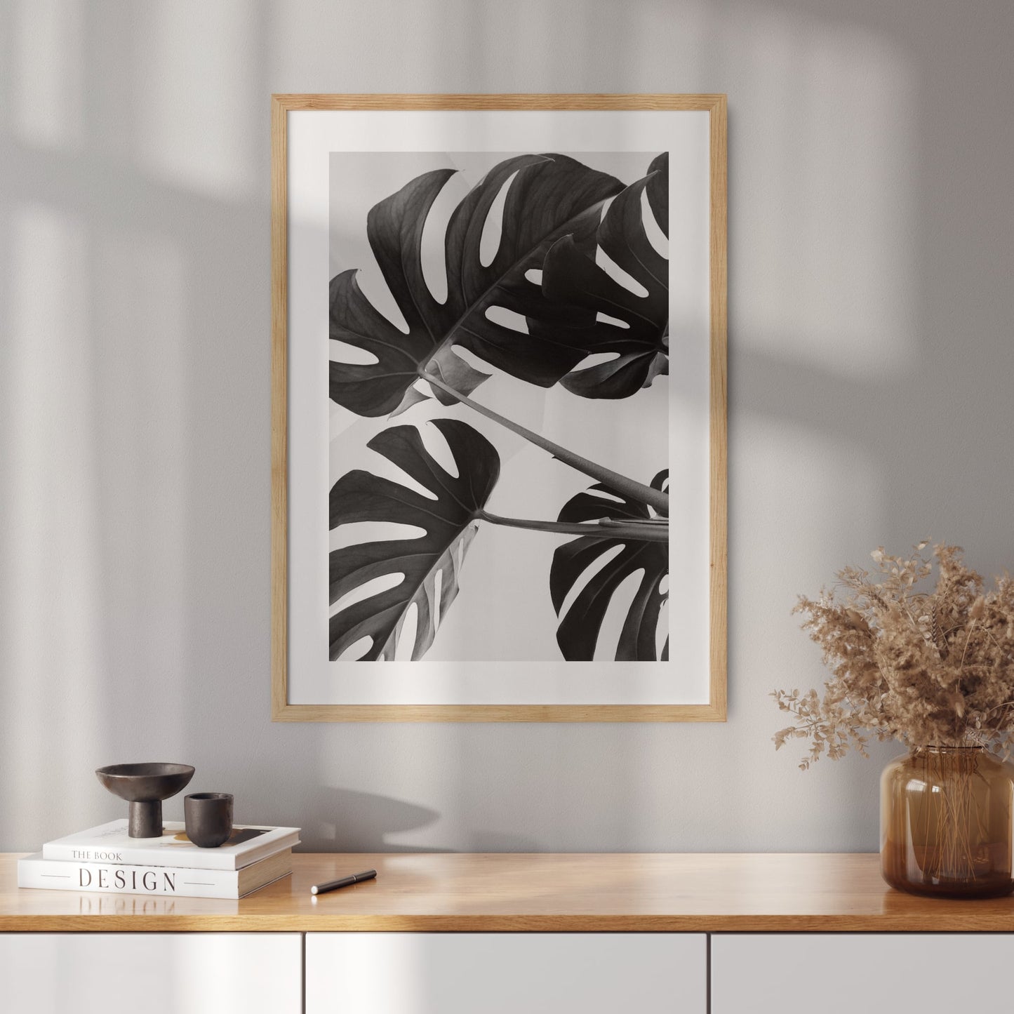 Poster with a photo of monstera leaves